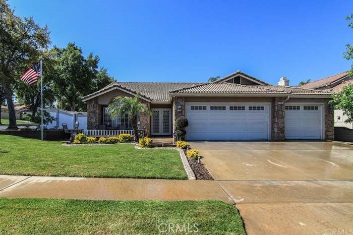 Welcome to this beautifully updated single-story home located in the highly desirable South Corona neighborhood. This spacious 3-bedroom, 2-bathroom home offers 1,909 square feet of comfortable living space with recent updates throughout. The main living areas feature attractive laminate flooring, while the bedrooms are carpeted for added comfort. The inviting living room includes a cozy fireplace, perfect for relaxing evenings at home. The kitchen comes equipped with an oven/range, built-in microwave, and dishwasher, making it functional and ready for your culinary needs. Additional features include an attached garage, a private backyard, and central heating and air. Pets are considered on a case-by-case basis. This home is available for immediate move-in. Situated in a quiet residential area, this home is part of the highly rated Corona-Norco Unified School District, with Santiago High School nearby. Outdoor enthusiasts will enjoy proximity to local parks such as Citrus Park and Mountain Gate Park, while shopping, dining, and freeway access (15 and 91) are just minutes away. Don’t miss the opportunity to live in one of Corona’s most sought-after communities—schedule your tour today!