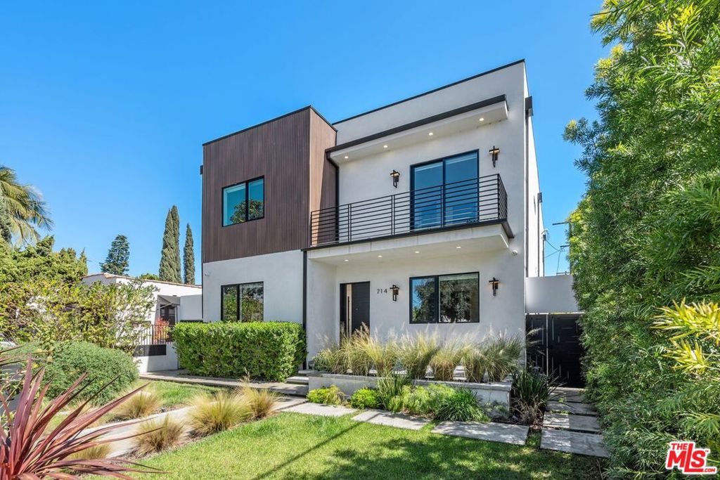 Welcome to this fully gated, stunning modern masterpiece located in one of Los Angeles' most vibrant neighborhoods. Surrounded by lush, mature landscaping, this five-bedroom, five-and-a-half-bathroom home seamlessly blends contemporary elegance with ultimate comfort. Designed for both luxury and functionality, each of the 5 spacious bedrooms in the main house features its own private ensuite bathroom, ensuring privacy and convenience. The primary suite is a true retreat with a private balcony overlooking the pool and spa, offering a peaceful escape. The spa-inspired primary bathroom boasts elegant finishes, a soaking tub, and a spacious layout, creating a serene space to unwind. At the heart of the home, the gourmet kitchen is a chef's dream, featuring high-end appliances, sleek quartz countertops, ample storage, and a seamless flow into the dining and living areas. Designed for effortless entertaining, the open floor plan is complemented by an integrated sound system, perfect for both intimate gatherings and lively get-togethers. Step outside to a private backyard oasis, where a sparkling pool and spa create a resort-style ambiance. The covered patio with an outdoor sound system, built-in BBQ, and lush greenery make this space ideal for hosting summer soires or relaxing under the California sun. A charming detached 418sqft pool house, complete with a bathroom and kitchenette, adds extra convenience and flexibility. This home offers unparalleled access to trendy coffee shops, top-rated restaurants, comedy clubs, art galleries, and moreall just steps away. AT&T Fiber internet available! Planters in the back of the house have been removed to include 2 car parking, and new 220V EV charging port capabilities added from the guest house.