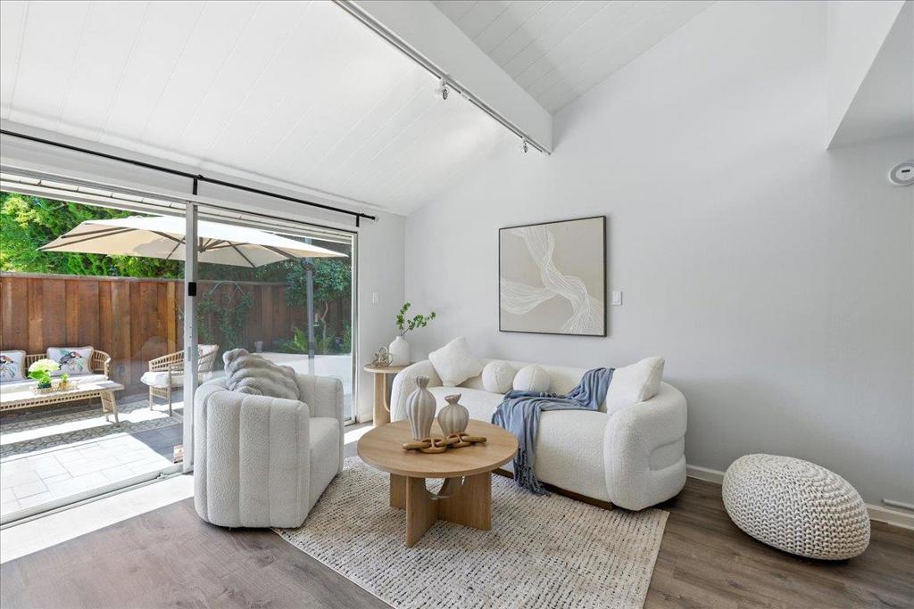 Perfectly located in the heart of Silicon Valley, this charming 4-bedroom, 2.5-bathroom single-family-like townhome in the heart of Mountain View, offering approx. 1,475 sq. ft. of living space (buyer to verify) has bright end-unit home features vaulted ceilings, abundant natural light, and a seamless floor plan. Recent upgrades include a brand-new roof, fully renovated bathrooms, kitchen, sound proof walls, and high-quality appliances. The modern kitchen opens to the dining and living areas, perfect for everyday living and entertaining. The converted garage provides a fully functional 4th bedroom with a large illuminated closet, heating, and a window, while the remaining half-garage is ideal for bikes or storage. A spacious backyard and side yard with direct access to the community pool make it feel like your own private retreat. Located in a safe and welcoming community with well-kept grounds, convenient parking, and a heated swimming pool. Its prime location is just around 5 mins drive/8 mins bike from Google and 10 to 17 mins from Meta, NVIDIA, Stanford, and downtown. Everyday conveniences are steps away, with Starbucks and Safeway within a few minutes walk, and Costco, Whole Foods, Trader Joes, and 99 Ranch Market all nearby.