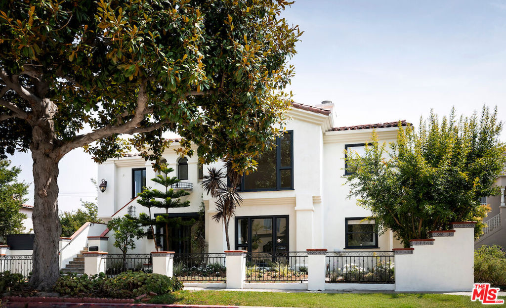 A rare chance to own a beautifully enhanced fourplex in the heart of Beverly Hills with serious upside potential. Set on a prominent corner lot on a picturesque, tree-lined street, this gated Mediterranean-style property already features notable improvements including a refreshed facade, upgraded landscaping, and updated interiors. But the true value lies in its flexibility, income potential, and room for strategic additions or further enhancements. Perfect for an owner-user or investor seeking long-term appreciation and short-term gains, this property offers a compelling mix of vacant and tenant-occupied units. The two massive front residences essentially single-family homes are delivered vacant, allowing for immediate leasing at market rates, luxury furnished rentals, or personalized use. Each offers 3 bedrooms, 4 bathrooms, spacious living areas, formal dining rooms, breakfast nooks, and updated kitchens with premium finishes. The top unit features a private roof deck with panoramic views, while the bottom unit enjoys a large private patio both ideal for high-end tenants or elevated owner living. The two rear 1-bedroom units add to the versatility and cash flow, whether used for long-term tenants, guest quarters, or short-term rental income. With this layout, the potential for optimizing rents, exploring ADU conversion (buyer to verify), or even luxury redevelopment in the future is substantial. Additional highlights include multiple outdoor entertaining areas, grassy yard space, a tranquil fountain, and a gated entrance for privacy and security.Situated just minutes from Rodeo Drive, world-class restaurants, Century City, and major freeways, this property is not just a stunning place to live it's a smart, high-upside investment in one of LA's most iconic neighborhoods.