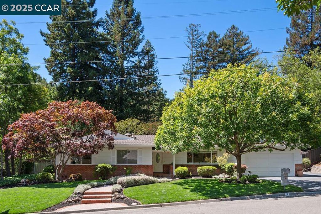 This single-level, 2,007± sq. ft. rancher, built by renowned builder Harold Smith, seamlessly blends comfort with thoughtful updates, including a new electrical panel and additional insulation, to enhance efficiency and peace of mind. A spacious skylit kitchen, the heart of the home, has seen hundreds of loaves of sourdough rise on its counters, while both a living room and a family room provide multiple spaces to gather and relax. The tranquil primary suite is joined by three additional bedrooms, and two recently remodeled bathrooms add fresh, modern appeal. A versatile bonus room sits apart from the bedroom wing, ready to serve as a home office, studio, or mudroom. Outdoors, a nearly half-acre lot unfolds into a private retreat: lawn, winding paths, and a mini orchard with persimmon, fig, Satsuma orange, Kaffir lime, Gala and Fuji apples, and multiple Meyer Lemon trees. Roses and mature landscaping complete the picture, creating a backyard ready for play, gardening, or evening entertaining. Families are especially drawn to Moraga for its top-ranked schools. Campolindo High School consistently earns a 10/10 GreatSchools rating and an A+ Niche grade, while Joaquin Moraga Intermediate and the elementary schools, Los Perales, Camino Pablo, and Donald Rheem, are among the best.