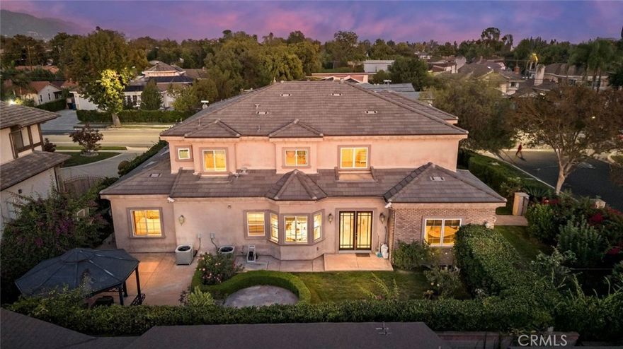 Experience modern luxury at 185 E Norman Ave, a pristine south-facing estate designed by acclaimed architect Robert Tong. Each room is generously sized with abundant natural light and excellent privacy—ideal for multi-generational living. The home’s balanced, thoughtfully planned layout enhances openness, comfort, and flow throughout. A grand foyer leads to a private office and an elegant living room with a custom fireplace. The gourmet kitchen features a large island, premium stainless steel appliances, and granite countertops, complemented by a separate wok kitchen. Downstairs, two en-suite bedrooms have been combined to create a spacious secondary primary suite, while an additional guest suite with its own full bath offers convenience and flexibility. Upstairs, the luxurious primary suite includes a custom walk-in closet and a spa-inspired bathroom. The private backyard serves as a tranquil retreat, complete with mature landscaping, an inviting entertainment area, and a diverse collection of fruit trees and providing year-round enjoyment. Seasonal roses and blooming flowers further enhance the garden’s beauty.Located within the award-winning Arcadia Unified School District and minutes from top dining, shopping, and everyday amenities, this exceptional residence offers the finest in Arcadia living—move-in ready and truly one of a kind.