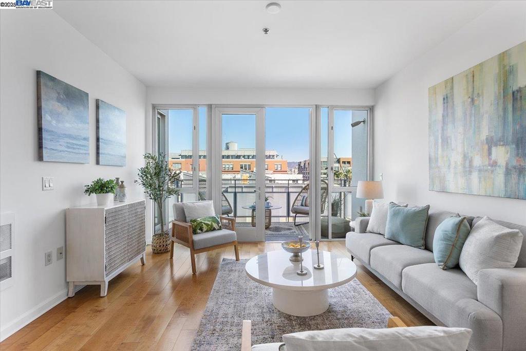 Step into penthouse-style living designed by renowned architect David Baker, celebrated for his people-centered urban spaces. This top-floor retreat is giving mid-century modern charm with clean lines, open flow, and light-filled interiors that invite both relaxation and inspiration. The bonus flex space offers endless possibilities; use it as your stylish home office, creative studio, or welcoming guest room. With its sleek finishes, thoughtful design, and elevated ambiance, this home strikes a perfect balance between comfort and sophistication. Nestled in a secure, well-maintained high-rise, you’ll enjoy both privacy and connection, just moments from everything that makes Jack London Square one of Oakland’s most dynamic neighborhoods. Hop on the Oakland Ferry for a scenic commute to San Francisco, catch a train at the nearby Amtrak station for a weekend getaway, or explore local favorites like waterfront dining, cozy coffeehouses, and lively entertainment right outside your door. This is Jack London living at its best!
