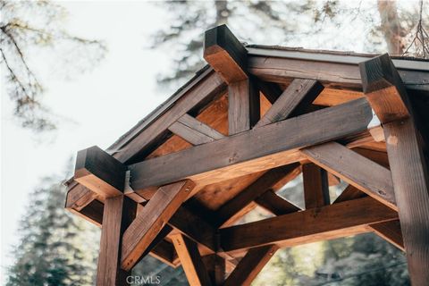 Photo of 576 Kuffel Canyon Rd, Lake Arrowhead, CA 92352 (MLS # IG26056188)