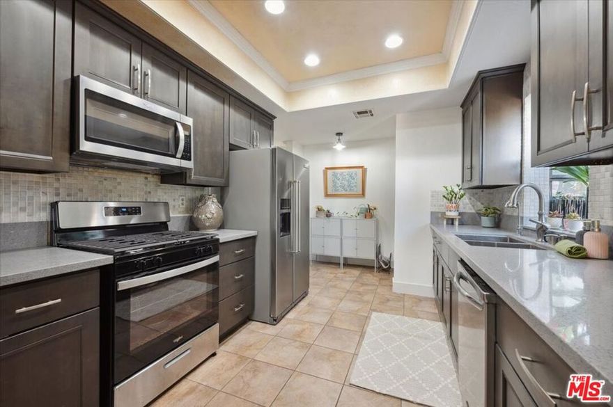 Welcome to your charming home located in the heart of Sherman Oaks.  This contemporary home offers a comfortable and convenient living experience.  Step inside this 2-bd, 2-bath END UNIT spanning 1298 sqft, and you'll immediately notice the well-designed layout and thoughtful details. The living spaces are bright and inviting, perfect for both relaxation and entertaining. The master bedroom is so spacious with walk-in closet and ensuite bathroom.  The kitchen is a chef's dream with bay window, boasting high-end appliances and ample storage space. A stackable high-end washer & dryer are included. Adjacent to the kitchen, you'll find a bar with sink and a private outdoor space, ideal for enjoying your morning coffee or unwinding after a long day. Enjoy access to a range of amenities, including a gym, two heated pools from May 1 - Oct 31, a sauna, a spa, and a rec room w/ kitchen and ample of guest parking. SIDE by SIDE Parking assigned for this unit.  Whether you prefer a refreshing swim, a rejuvenating workout, or a relaxing soak in the spa, this community has you covered. This home is surrounded by an array of dining, shopping, and entertainment options, providing the perfect blend of urban convenience and suburban tranquility. HOA COVERS:  EQ ins for the building, basic cable by Direct TV, internet by AT&T, building maintenance, sewer, trash, hot and cold water. Pet friendly building.  Rental restriction 1 year after change ownership.  Don't miss the opportunity to make this delightful unit your home.