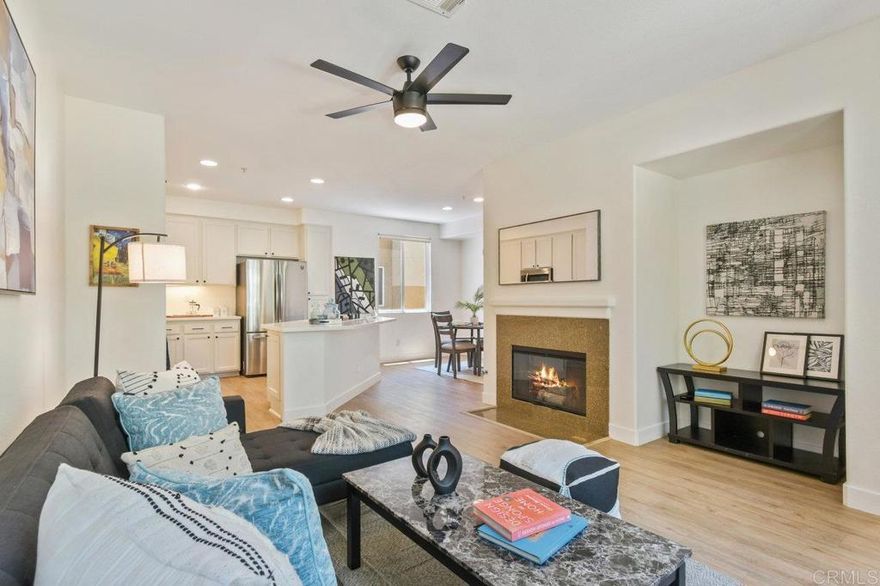 Come Home to this Beautifully Tri-Level townhome Offering a spacious 1,400 sq.ft of living space. This 2-bedroom, 2.5-bathroom, 2-Car Garage Home includes a First Floor Versatile Bonus Flex-Room Ideal for an Office,Gym,Media Room or Guest Space. Freshly Painted, Laminated flooring throughout, Upgraded Kitchen with Stainless Steel Appliances with ample Cabinetry and Upgraded Bathrooms.The Main floor features a bright and airy living area with a Cozy Fireplace, perfect for both entertaining and relaxing. Step out onto the private Balcony to enjoy the morning coffee or Just to Relax and Unwind On your own tranquil outdoor retreat. The Primary Suite Features a walking in  closet an upgraded tub and dual sinks for added comfort. Central AC. The Treviana Community offers  Resort-Style Amenities Including a Sparkling Pool Equipped Gym. Close to Award Winning Schools, Parks, Walking Trails, Otay Ranch Mall Center, Restaurants, Movie Theaters, Enjoy the ideal balance of cozy living, everyday convenience, and a welcoming neighborhood, all in a Prime Location.