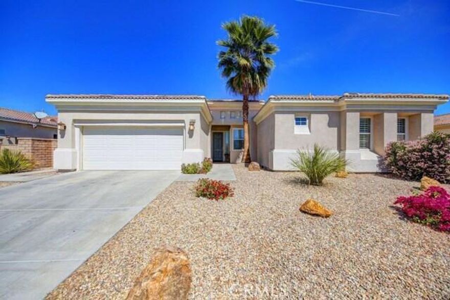 Discover this meticulously maintained and beautifully presented residence, ideal for growing families, seasonal retreats, or as a savvy investment property. Located in the highly sought-after Esplanade development, this home features one of the most desirable floor plans available.With its open and airy layout, this move-in-ready home boasts three spacious bedrooms, plus a versatile den/office that can easily serve as a fourth bedroom. Enjoy the elegance of 4.5-inch plantation shutters throughout, enhancing both privacy and style.The backyard is a perfect haven for family gatherings, peaceful relaxation, or practicing your chipping and putting skills. Don't miss out on this gem in the heart of the desert!