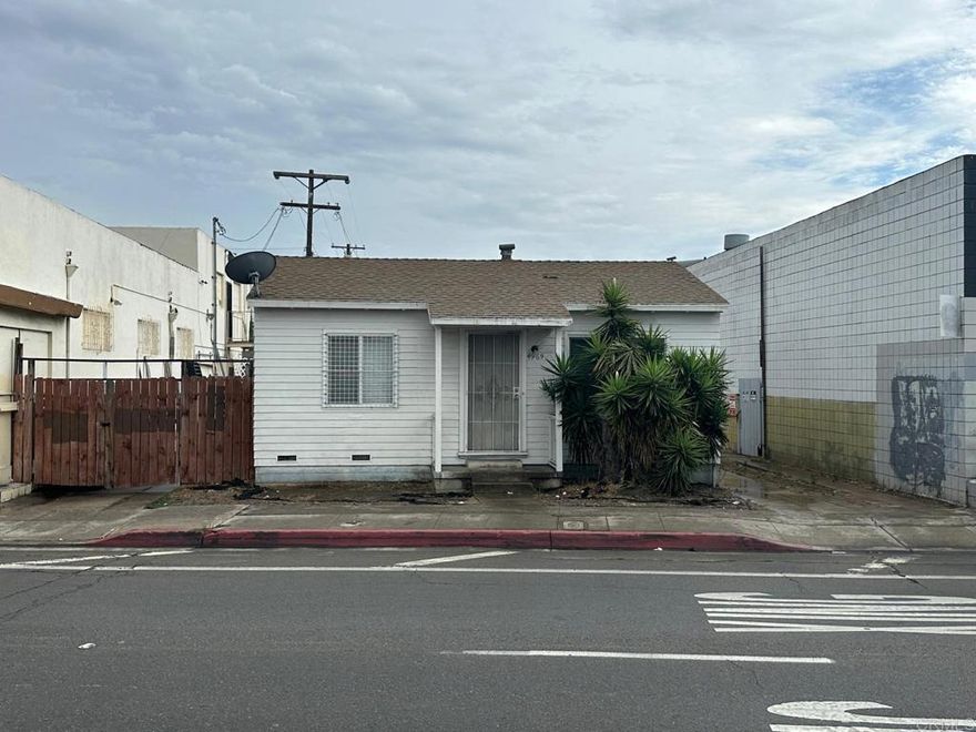 Mixed-use property — fixer with ADU potential or option to demolish and redevelop. Best sold together with 4973-83 University Ave.