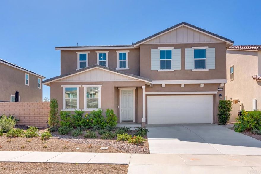 Opportunity knocks in the Heart of Menifee! Built in 2023, this stunning 4-bedroom, 3-bathroom home spans 2,697 sq. ft. of thoughtfully designed living space—perfect for comfort, style, energy efficiency, and functionality.  Step inside to an open-concept space filled with natural light from an abundance of windows. The gourmet kitchen is a true showstopper, featuring white shaker cabinets, sleek quartz countertops, stainless-steel appliances, a large center island, and pantry, all seamlessly flowing to your backyard oasis with center-meet patio doors.  Enjoy the flexibility of a main-floor bedroom and bath, perfect for guests or multigenerational living, plus a convenient upstairs laundry and versatile loft space, ideal for a home office, playroom, or media area.  The luxurious primary suite offers the perfect retreat with added windows, a spa-inspired ensuite with dual sinks, and an expansive walk-in closet. Two additional bedrooms share a well-appointed bath, and a laundry room with side by side stainless-steel washer/ dryer complete the upstairs layout.  Additional highlights include solar, a smart thermostat, wood laminate flooring, ceiling fan prewiring, a two-car garage with service door, and an easy-to-maintain backyard featuring artificial turf, ready for you to create your own outdoor oasis.  Located in a sought-after Menifee neighborhood surrounded by trails, close to schools, shopping, dining, and freeway access, this home is the perfect blend of modern comfort and everyday convenience.