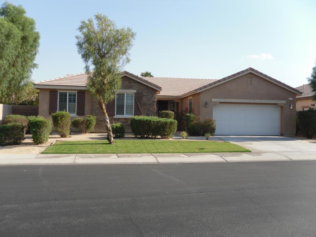 Welcome to 81917 Villa Palazzo located in the desirable gated community of Palazzo where the HOA's are low. This home is being sold partially furnished per inventory list. As you enter the gate to the community this is the first home inside the gate situated next to a beautiful greenbelt. Entering the home you will find the newly tiled Living Room which then leads to the open concept Dining Room and Kitchen with a Den/ Library/Office space, as well, with a full wall of Library style bookcases. There is recessed lighting throughout. The stylish contemporary kitchen features granite countertops, stainless steel appliances with an additional side by side refrigerator in the garage, ample cabinetry for storage, walk-in pantry, and a large island perfect for entertaining family and friends. There are new ceiling fans as well as plantation style shutters in all rooms. The Primary Bedroom has a large bathroom with double sink vanity, separate shower and soaking tub and a walk in closet. The half bath has been upgraded with all new fixtures including vanity, lighting and toilet. Sliding glass door leads to a covered patio for additional space, expanding your entertaining options. In the backyard you will find mature landscaping for privacy and a matching storage shed. And for your comfort there is also an A/C unit for the garage space. This home has been well maintained and is ready for you to enjoy.