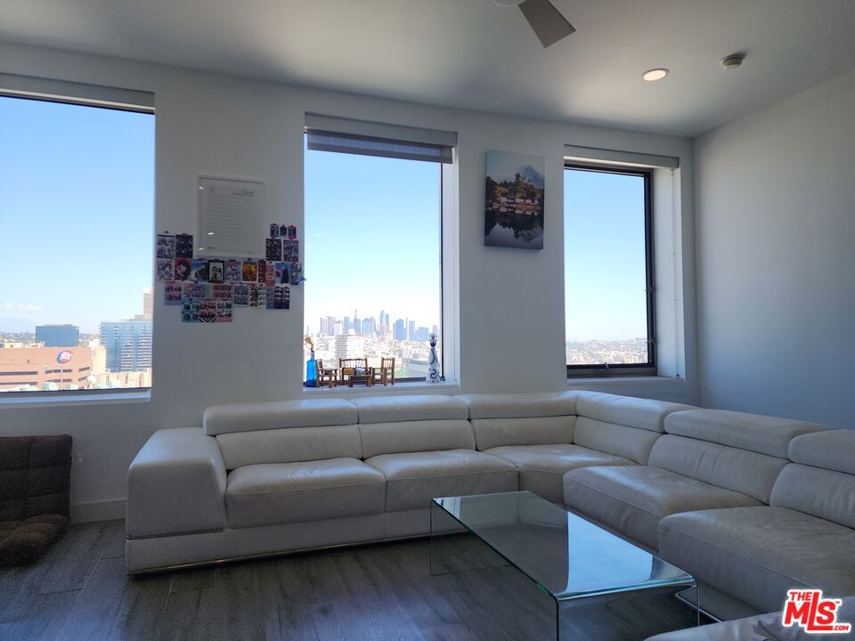 Welcome to Residence 1706 at The Mercury, the best location one-bedroom, one-bathroom unit offering the perfect blend of modern design, comfort, and luxury amenities. Situated on a high floor, this bright home features unobstructed views of downtown Los Angeles through expansive windows, creating a serene backdrop for everyday living. Interior Features: Open and airy layout with high ceilings, beautiful waterproof flooring, and with a little tender loving care, this is a gem you cannot find elsewhere. Modern kitchen with a large island, stainless steel appliances, glass tile backsplash, and ample cabinetry. Brand new washer, dryer combo included in the sale. Custom built-in cabinetry and abundant storage throughout the unit. Private balcony perfect for enjoying panoramic views of Los Angeles. Secure fob-controlled elevator access and 24/7 front desk service for packages and guests. Sky Deck Amenities: The Mercury offers resort-style living on its rooftop Sky Deck, with; Heated infinity-edge pool and Jacuzzi spa. Fully equipped fitness center with panoramic views of the Hollywood Sign and Los Feliz. Shaded BBQ and lounge areas with multiple seating spaces. A tranquil grass garden and pet-free lawn for relaxation. Location: Perfectly located in the heart of Koreatown, residents enjoy walking access to trendy restaurants, cafes, shopping, and essential services. The building also offers ample guest parking, a rare convenience in the city.