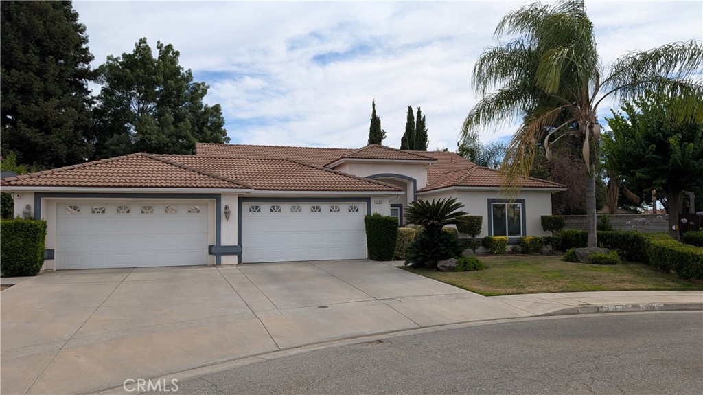 Sprawled on a large, oversized lot, this Home Ranch estate offers a rare opportunity of style and comfort. Beginning with large four car garage, enjoy the peace of mind with viable storage options for your cars and personal belongings. The interior living area offers vaulted ceilings in the family room, with tasteful color tones and modern updates. A newer A/C unit was installed a couple years back along with a brand new water heater in 2025. Upgraded lush carpet is available in living areas and bedrooms. Each room offers its unique personality with custom paint. Step outback to two patio areas, along with an abundance of space on the east and west side of home. Entertaining will be a joy with plenty of room for family and friends. Call your Realtor today for a private viewing.