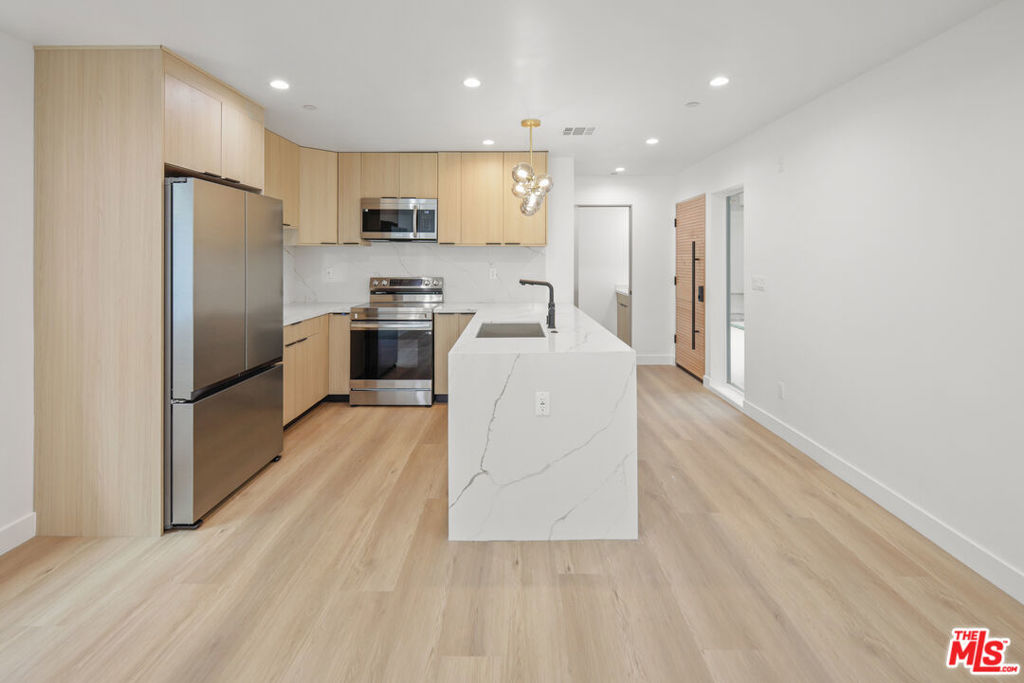 **BRAND NEW CONSTRUCTION ** PRIVATE YARD ** ASSIGNED PARKING ** WASHER/DRYER ** CENTRAL A/C ** KITCHEN ISLAND ** PET FRIENDLY ** Welcome to The Hortense Townhomes, a brand-new luxury residence in the heart of North Hollywood offering high-end finishes, spacious interiors, and unbeatable amenities. These thoughtfully designed units feature expansive living rooms, oversized bedrooms, and open-concept layouts perfect for modern living. The chef's kitchen boasts a large island, beautiful stainless steel appliances, quartz countertops, and custom cabinetry. Each unit includes an in-unit washer and dryer, central A/C and heat, recessed lighting, and premium flooring throughout. Enjoy your own assigned parking space for added convenience. The building is pet-friendly and ideally located on a quiet residential street just minutes from the vibrant NoHo Arts District, Toluca Lake, studios, shops, restaurants, and transit. This is elevated urban living at its finest. Don't miss your opportunity to call it home!