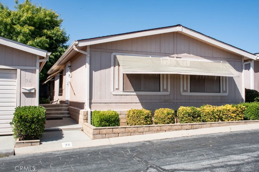 This home in the 55+ community of Banning Estates is ready for its new owner, with a PERMANENT FOUNDATION, OWNED SOLAR, and NO SPACE RENT (you own the land!). Upon entering the home, you'll be greeted with a spacious formal living/dining room with a built in hutch and wide windows for ample light. The area opens to a family room/den/tv room which adjacent to the kitchen, which features a pantry, plenty of counter and cupboard space, and room for a kitchen table. The laundry room is convenient to the living areas and features office/work/hobby space and access to the guest bathroom. The large primary bedroom with en suite features a soaking tub and stand alone shower, a vanity, and ample closet space. The 2nd bedroom rounds out the home and is perfect for guests, a care giver, or additional office/library/hobby space! Outside you'll enjoy a shady, low maintenance yard with a covered patio which is connected to the detached two car garage. Banning Estates offers the comfort of a 55+ neighborhood with a low (approx. $140/mo) HOA fee, a community pool, green spaces, and a clubhouse, as well as close proximity to local amenities, shopping, medical facilities, freeway access, and more! If you're in the market for an affordable home in a 55+ community, look no further than this well maintained home!