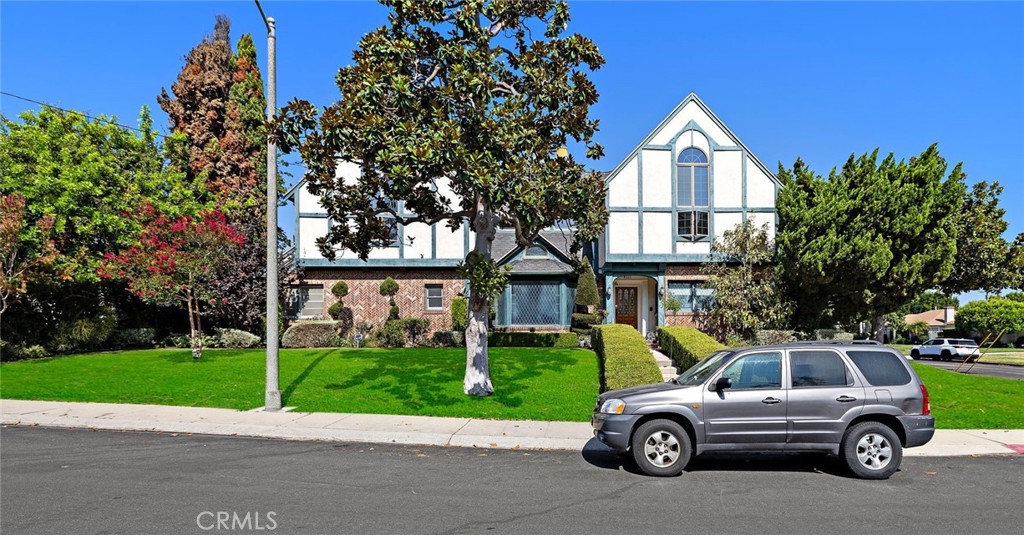 Welcome to a stunning, spacious 3-bedroom (with potential for a 4th bedroom on the second floor), 4-bath home located in the heart of Westchester’s premier Kentwood neighborhood. This beautifully crafted residence exudes European-style charm and elegance throughout.
Step inside to discover a large, fully remodeled kitchen featuring top-of-the-line appliances-ideal for home chefs and entertainers alike. The home’s architecture is a timeless blend of sophistication and warmth, showcasing original Tiffany windows, a grand staircase leading to the second floor, and a generous balcony, perfect for enjoying your morning coffee or relaxing in the evening. The expansive primary suite offers a private retreat with a sitting room, private balcony, and an abundance of space, plus a luxurious spa bath. A formal dining room and a living room with a fireplace, along with a separate family room (also featuring a fireplace), provide the ideal layout for both everyday living and entertaining.
Outside, the oversized lot features a sparkling pool, creating your own private oasis. This is a prime location-just minutes from Playa Vista, Playa Del Rey, Santa Monica, LAX, LMU, SoFi Stadium, and some of LA’s most beautiful beaches, parks, and shops.