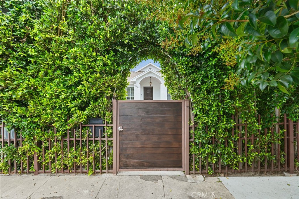 Discover this newly remodeled 3-bed, 2-bath home in Los Angeles that exudes luxury and style. Fenced and gated, you 'll love cooking in the kitchen with granite countertops, relaxing in the elegant open living space, retreating to the primary suite with a walk-in closet, enjoying outdoor moments in the immaculate backyard, storing essentials easily with ample loft storage. The entryway creates an impressive and elegant first impression with manicured lawns, beautiful flowers, matured trees, and concrete front. A beautifully crafted front door leads you to the sweeping open floor plan that seamlessly connects the formal living room with the dining and family room areas. Beautiful flowers and manicured lawns grace the front and back yards. Equipped with surveillance cameras, home offers style, privacy, convenience, and an ideal living environment! Oakwood flooring throughout including the master bedroom, except the other two rooms with laminated flooring. Concrete front and backyards. There is half bathroom at the rear. Long driveway from the front to the rear. This exquisite residence is truly a masterpiece of craftmanship. Don't miss out on experiencing this blend of elegance and comfort.