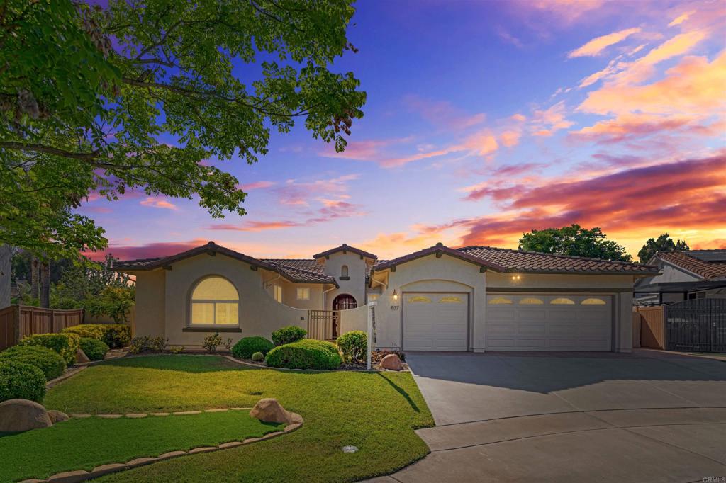 Single-Level Living. Sweeping Views. No Fees. Welcome to 837 Calle Lagasca, a rare opportunity in the coveted Alta Mira community of Rancho Del Rey. This beautifully maintained single-story home sits at the end of a quiet cul-de-sac on an elevated ¼-acre lot, offering unobstructed views of the Coronado Bridge and downtown San Diego. Step through double doors into a light-filled interior with high ceilings, a private entry courtyard, and a bright, open layout. Enjoy two generous living areas, both anchored by a double-sided fireplace, along with central air and heat for year-round comfort. The kitchen features ample cabinet space, a large center island, and flows effortlessly into the second living area—perfect for gatherings or quiet evenings. Sliding doors lead to your backyard retreat with a covered patio, built-in BBQ, lush landscaping, and those stunning panoramic views. The primary suite offers backyard access, its own fireplace, a walk-in closet, and a spacious ensuite bath. Three additional bedrooms, a dedicated laundry room, and a 3-car garage complete the layout. And the best part? No HOA. No Mello-Roos. Just timeless charm, privacy, and a prime location you’ll love coming home to.