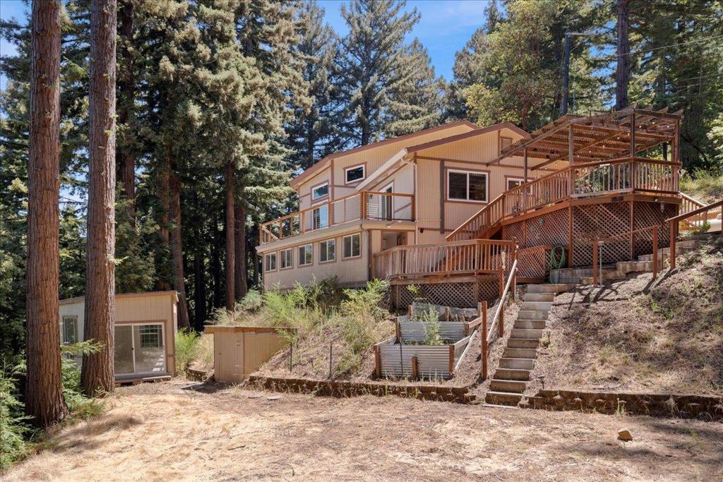 Dont miss this spacious & truly unique mountain retreat! Nestled in a peaceful, friendly neighborhood just 2.7 miles from Hwy 17 and 10 miles to downtown Los Gatos, this property offers breathtaking views of the Santa Cruz Mountains and is located within the sought-after Los Gatos School District. The home features vaulted wood ceilings, rustic charm, & a versatile loft space that could become a primary suite. Inside, youll find a separate family room & living room, kitchen/dining combo, & a two-tiered deck ideal for enjoying the serene surroundings. Recent updates include new windows, a refreshed fireplace and hearth, interior paint, and a Honeywell backup generator. The property also offers updated electrical, hidden storage, RV/boat parking, and space for livestock or gardening. Downstairs includes a studio rental with private entrance and bath, providing income potential, plus a large detached unit perfect for a yoga/art studio, gym, man cave, or playroom. With room for a potential ADU, this 1978-built home is full of charm, updates, and endless possibilitiesa true entertainers must-see! Owner is VA-friendly and offering a flooring credit for carpet replacement. Located in a highly desirable neighborhood with Mountain Charlie Road currently being repaved for easier commuting.