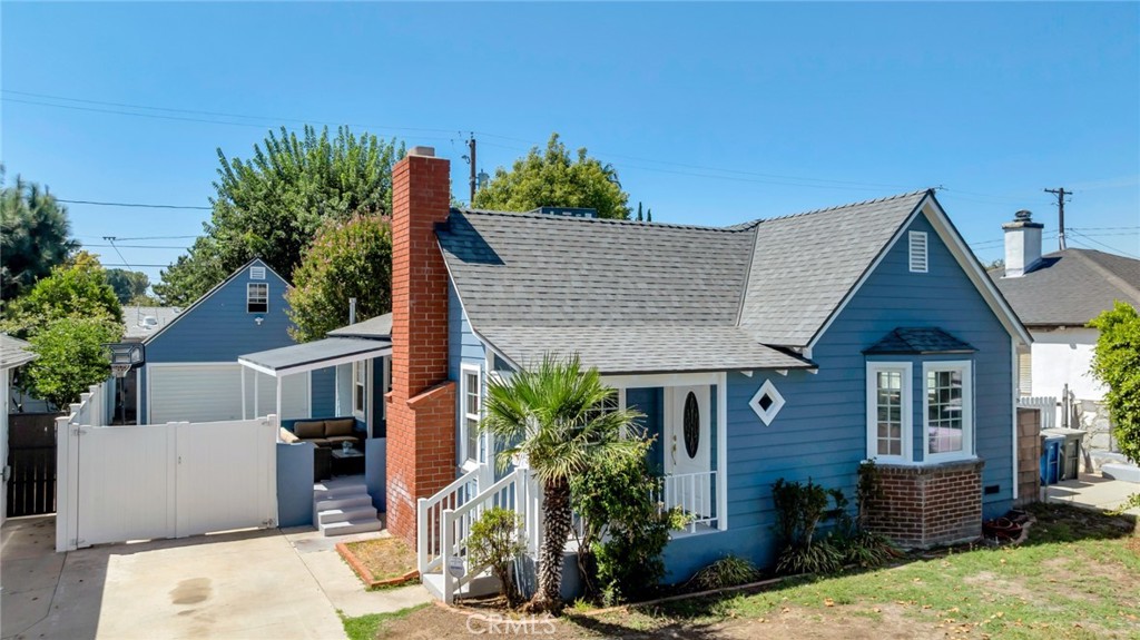 Classic Cape Cod charm in a prime Burbank location! This light-filled home features refinished hardwood floors, a welcoming living room with coved ceilings and a cozy fireplace, and a formal dining room with a vintage china cabinet and sliding doors that open to a private patio—perfect for morning coffee or easy entertaining. The kitchen offers generous counter space with freshly painted cabinets for a crisp, clean look, while a front bedroom is accented by a delightful bay window. Out back, a detached 2-car garage with a high-pitched roof and loft provides outstanding storage and flexible bonus space—great for a studio or potential ADU opportunity (buyer to verify). A charming, move-in-ready gem in one of Burbank’s most desirable neighborhoods!