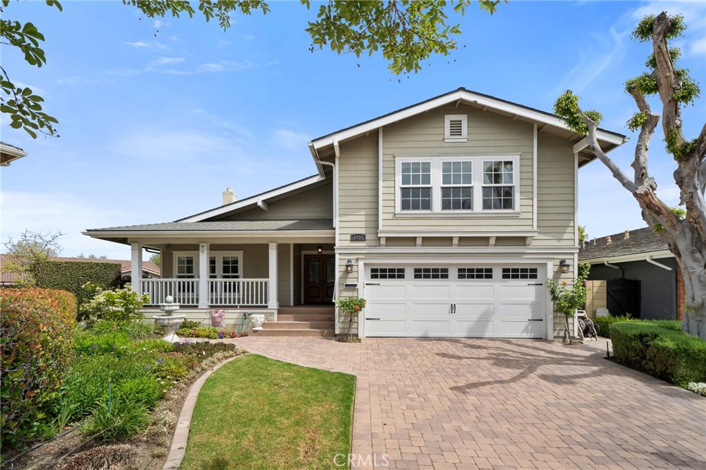 Nestled on a quiet cul-de-sac in the most serene interior pocket of College Park North, this classic S&S home ideally sits on an expansive 8,600 square foot lot. Beautifully finished with an interlocking-brick driveway and a welcoming front porch with a white handrail, surrounded in lush colorful landscaping. Built in 1970, the residence offers nearly 3,000 square feet of airy open living space - ready for your personal finishes. The double-door entry opens to a formal foyer, where vaulted ceilings crown the spacious living room and step-down dining area. A reimagined kitchen complete with a center island, extended cabinetry, and a walk-in pantry flows into an oversized family room accented by hardwood floors, recessed lighting, and twin sets of French doors with views of the backyard oasis. A casual dining nook with built-ins and a sliding door to the side yard, plus a main-floor interior laundry room, add everyday convenience. Upstairs, this ideal floor plan features four generous bedrooms and a huge bonus room (easily a fifth and sixth bedroom option) outfitted with built-ins and wall-length closets. The primary suite offers a walk-in closet, vanity area, and en-suite bath. The main bath has been tastefully updated with newer cabinetry, granite counters, and an upgraded shower. Step outside to a resort-style backyard designed for entertaining. A large multi-step swimming pool anchors the space, complemented by a covered patio, perfect for al fresco dining. The side yard showcases a garden for those with a green thumb. Additional highlights include central heating and air conditioning, direct access to a double-bay garage with roll-up doors and windows, and the charming upgraded front porch surrounded with plush landscaping - ideal for relaxing with family, friends and neighbors.This well-maintained home is a fantastic opportunity to own a spacious home on a very large lot in Los Alamitos. All of this comes with the added appeal of being located within the highly rated, award-winning Los Alamitos School District and close to premier shopping and dining options. A wonderful opportunity to personalize a fabulous floor plan on a super-size lot with an ideal quiet and private location. Make this exceptional College Park North home distinctly yours.