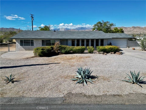 Photo of 7390 Victoria Avenue, Yucca Valley, CA 92284 (MLS # JT26232782)