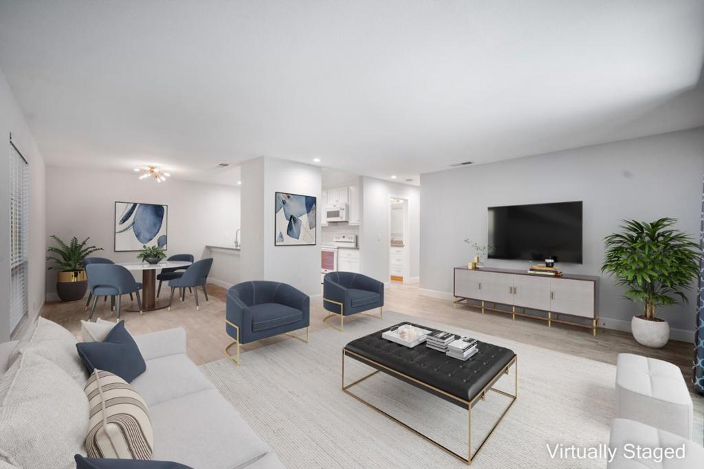 Welcome to this impeccably remodeled townhome, where contemporary design meets ultimate convenience. This elegant 2-bedroom, 1-bathroom residence offers modern upgrades and practical features, making it ideal for discerning buyers. Inside, discover sleek quartz countertops, a stylish subway tile backsplash, and upgraded flooring. The kitchen and bath feature quartz counters and copper plumbing, ensuring beauty and functionality. Recessed lighting and energy-efficient appliances add to the ambiance and efficiency. The private courtyard provides a tranquil oasis, perfect for quiet moments or entertaining guests. Steps from the community pool, spa, and clubhouse, enjoy relaxation and recreation at your doorstep. Situated in the peaceful interior of the development, this townhome offers privacy, sharing only one wall with a neighbor. Ample parking and a designated carport offer convenience, with additional storage on the patio. For tech professionals, this location is ideal - minutes from Nvidia, Apple, Google, LinkedIn, freeways, and CalTrain, making commutes a breeze. Experience the perfect blend of luxury, privacy, and convenience in this exceptional townhome. Make it yours and live the lifestyle you've always dreamed of! (Please note that this property has been virtually staged.)
