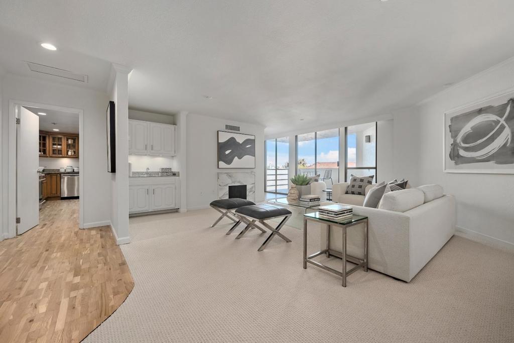 Discover the perfect blend of luxury, style, and convenience in this extraordinary two-level condo, located in the heart of vibrant downtown Burlingame. Every detail of this home has been thoughtfully curated to create a space that is both elegant and welcoming. The main floor offers a bright and spacious open-concept design, where floor-to-ceiling windows invite natural light and frame the view of your private patio. A stunning marble fireplace adds warmth and character, while the modern chefs kitchen boasts premium appliances, sleek countertops, and ample storage. The adjoining dining area opens to a private outdoor deck, ideal for al fresco dining or relaxed gatherings. Upstairs, retreat to the tranquil comfort of two generously sized bedrooms. The luxurious primary suite includes a walk-in closet and access to an expansive private patio, perfect for unwinding at the end of the day. The building provides unparalleled amenities, including secure access, underground parking for two cars, and elevator service. Resort-style features such as a pool, spa, gym, billiard room, meeting space, and additional storage ensure every need is met. Located steps from world-class dining, boutique shopping, and lively entertainment, this home is your gateway to the best of Burlingame.