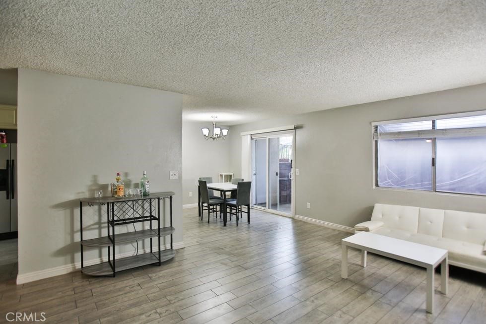 Located in the gated community of The Village in Diamond Bar, this beautifully updated downstairs corner unit features 2 bedrooms, 2 bathrooms, tile flooring throughout, a refreshed kitchen with a new dishwasher and garbage disposal, updated bathrooms, a cozy fireplace, newer A/C, and a private patio perfect for relaxing. The spacious master bedroom and comfortable second bedroom offer ample living space, while two assigned parking spots and a nearby community laundry facility add everyday convenience. Enjoy access to the community pool, spa, and clubhouse, all just minutes from the 57 and 60 freeways for easy commuting.