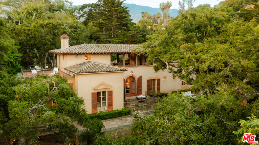 Set on nearly 16 ocean-view acres and nestled in the peaceful foothills of Carpinteria, Villa Calafia is a rare 1930s estate designed by esteemed architect Gordon Kaufmann, AIA, best known for Greystone Mansion and the Los Angeles Times building. This Tuscan-inspired retreat reflects the elegance and scale of California's architectural heritage. The 4-bedroom main residence reflects Kaufmann's refined vision, with arched thresholds, balanced proportions, and a quiet Mediterranean elegance that speaks to his architectural pedigree. Framed by ocean views, the home is well-preserved, honoring its historic character. The estate includes: three two-story, independent guest residences, each with their own living room and kitchen: a One-bedroom Tower House with sweeping ocean views, a 1-bedroom Serenity House, and the Woods House with two bedrooms. Together, they offer a flexible and private layout ideal for hosting, extended stays, or multigenerational living. The grounds feature a tennis court, equestrian facilities, 8 car covered parking, established citrus and avocado groves, and ample space for a future pool, curated gardens, or boutique vineyard. A true destination estate, Villa Calafia offers a rare escape nestled just minutes from Montecito and Santa Barbara. Far enough from Los Angeles to feel like a world away, yet close enough for a weekend commute or seamless relocation, it is a legacy property ready for its next chapter.