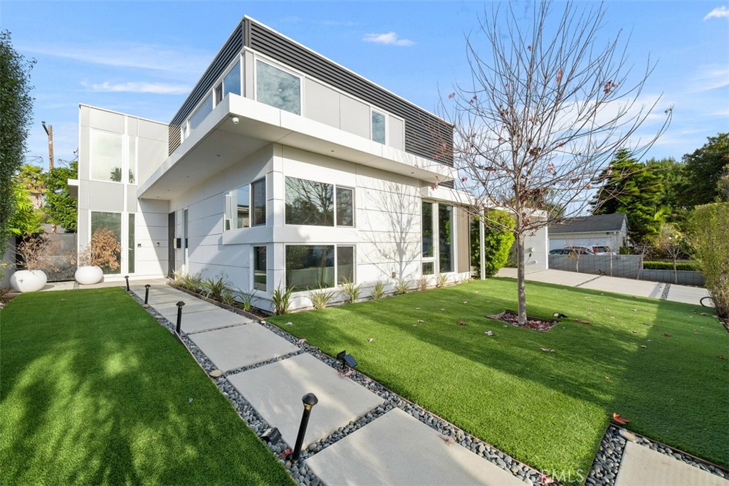 Discover an incredible opportunity to live in one of LA's most vibrant neighborhoods. This custom modern home built from the ground up, located in the heart of Carlson Park in Culver City California, is walking distance to the hippest shopping, dining and entertaining offers the perfect blend of style and convenience. The spacious home features 4 bedrooms, 3 full bathrooms and a powder room, along with a 360 square foot guest unit/home office with a separate entrance. Over 4,000 square feet in all. High ceilings with recessed lighting highlight the extra-long plank hardwood throughout. The large, open chef’s kitchen comes equipped with all Sub Zero Wolf appliances and Moroccan tiles, while the adjacent dining area is flooded with natural light. It is perfect for entertaining. Central air and heat, built-in ceiling speakers, custom privacy window tinting, Lutron smart lights, a whole house water filtration system, and electric car charger truly makes this the ultimate smart home that is also energy efficient. The guest unit/home office is perfectly configured, complete with its own full bathroom, full kitchen, with views of the secluded side patio--an ideal spot for enjoying your morning coffee before diving into the day's work or visiting in-laws. The inviting backyard offers a serene retreat with Meyer lemon and peach trees, 30-foot golf putting green, and a spacious side yard with custom shading to enjoy the weather. An easy walk to award-winning Farragut Elementary, Culver City Middle and High schools. A skip from Carlson Park, and a few blocks away from vibrant Downtown Culver City, Sony Studios, Amazon Studios, Jackson Market, Sephora, Erewhon, Equinox, The Culver Steps, Ivy Station, Platform LA, Apple and HBO, plus so much more. Come enjoy your own urban oasis!