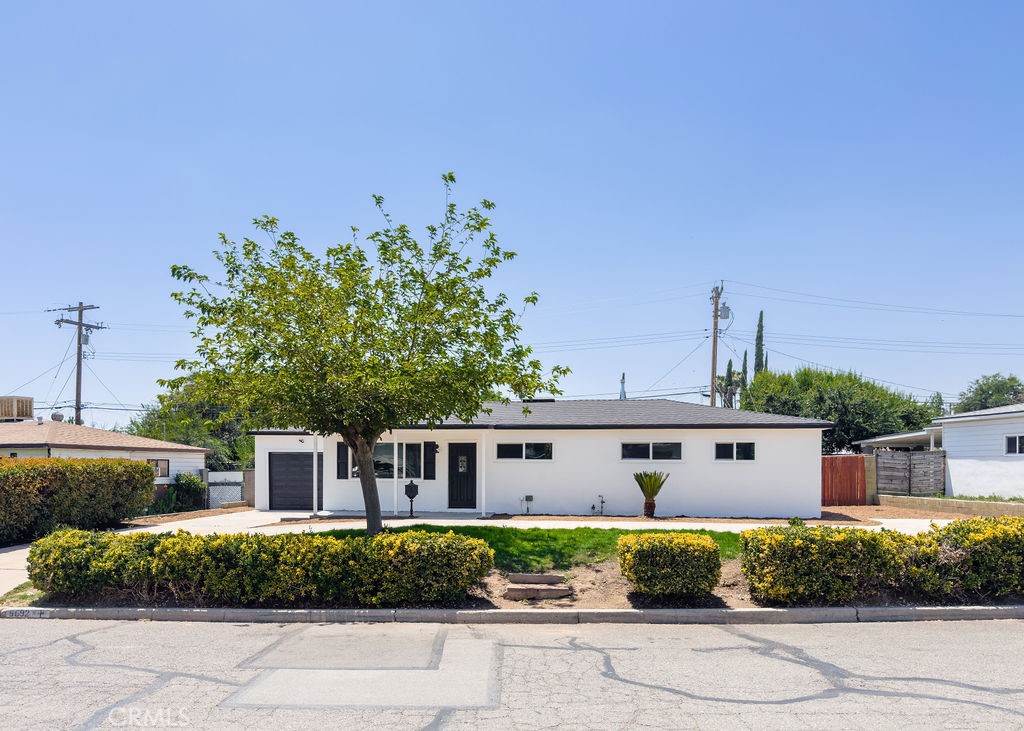Fully Renovated Mid-Century Gem on a Large Lot in San Bernardino! Welcome to this move-in-ready 4-bedroom, 2-bathroom single-family home offering the perfect blend of classic charm and modern updates. Situated on a spacious 8,915 sq ft lot, this freshly renovated 1,248 sq ft home is ideal for families, first-time buyers, or savvy investors. Step inside to find a bright and airy living room with updated roof, new windows, brand-new flooring, fresh neutral paint, and a charming white brick fireplace. The heart of the home—its stunning kitchen—features sleek white shaker cabinets, eye-catching hexagonal backsplash, quartz countertops, and brand-new stainless-steel appliances, creating a stylish and functional space for everyday living and entertaining. Both bathrooms have been tastefully redesigned with designer tile, modern vanities, matte black fixtures, and farmhouse-inspired touches. Each bedroom includes new flooring, fresh paint, and ceiling fans for year-round comfort. Enjoy the California sunshine in your expansive backyard with plenty of space to add a pool, ADU, or create your dream outdoor oasis. The front yard boasts drought-tolerant landscaping and a long driveway for ample parking, along with a freshly painted attached garage. Additional upgrades include a refurbished HVAC system, dual-pane windows, recessed lighting, and a brand-new roof. Ideally located near shopping, schools, parks, and freeway access.
Don’t miss this beautifully updated home with endless potential—schedule your private showing today!