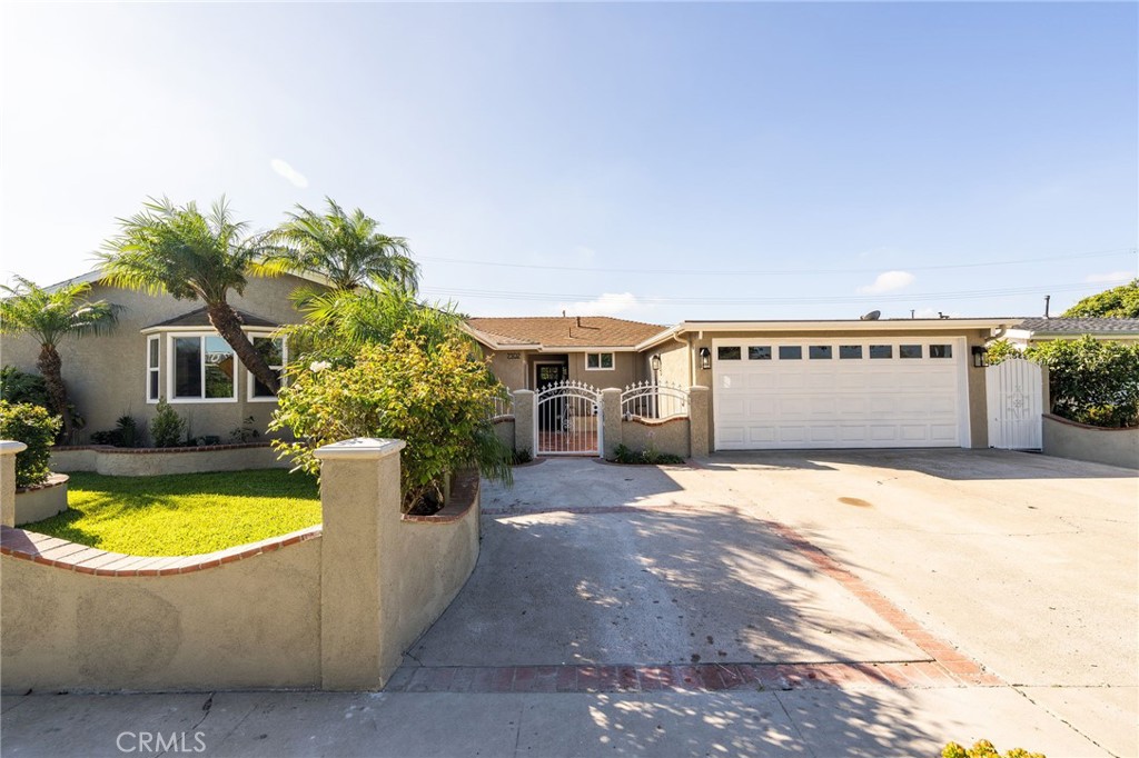 Welcome to this beautifully UPDATED 5 bedroom, 2-bathroom pool home. This home has an inviting curb appeal with an enclosed landscaped front yard and front courtyard area with new Saltillo tile. The kitchen has been updated with new two-tone cabinets, sleek counter tops, tile backsplash, stylish fixtures and stainless-steel appliances. The spacious primary bedroom has vaulted ceilings, a large walk-in closet with custom built-ins, and ensuite bathroom. Both the primary and hall bathroom feature new double sink vanities, stylish new fixtures, and custom tile work. Other features include freshly painted interior and exterior, new engineered hardwood flooring throughout the living area and bedrooms, new energy efficient vinyl windows, new plumbing and light fixtures, upgraded electrical panel, HVAC, new garage door and motor, and spacious indoor laundry room. This home is great for fun and entertainment with a great outdoor space. The private enclosed backyard has a large, covered patio, manicured yard and sparkling in ground pool and spa. There is a two-car garage and additional off-street driveway parking. Tax rolls show different bedroom and bath count and square footage.