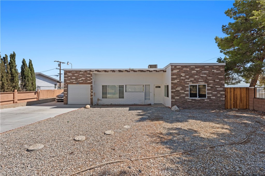 Welcome to this charming 3-bedroom, 2-bathroom home offering 1,563 sq. ft. of comfortable living space on a generous 7,245 sq. ft. lot. Tucked away in a peaceful rural area of Apple Valley, this property provides the perfect blend of privacy and convenience. The home features recently updated kitchen and bathrooms, giving it a modern and inviting feel. With RV parking and plenty of outdoor space, it’s ideal for those who love to entertain, store their toys, or simply enjoy the wide-open desert lifestyle. Don’t miss the opportunity to own this well-maintained property in a desirable location with room to grow and explore!