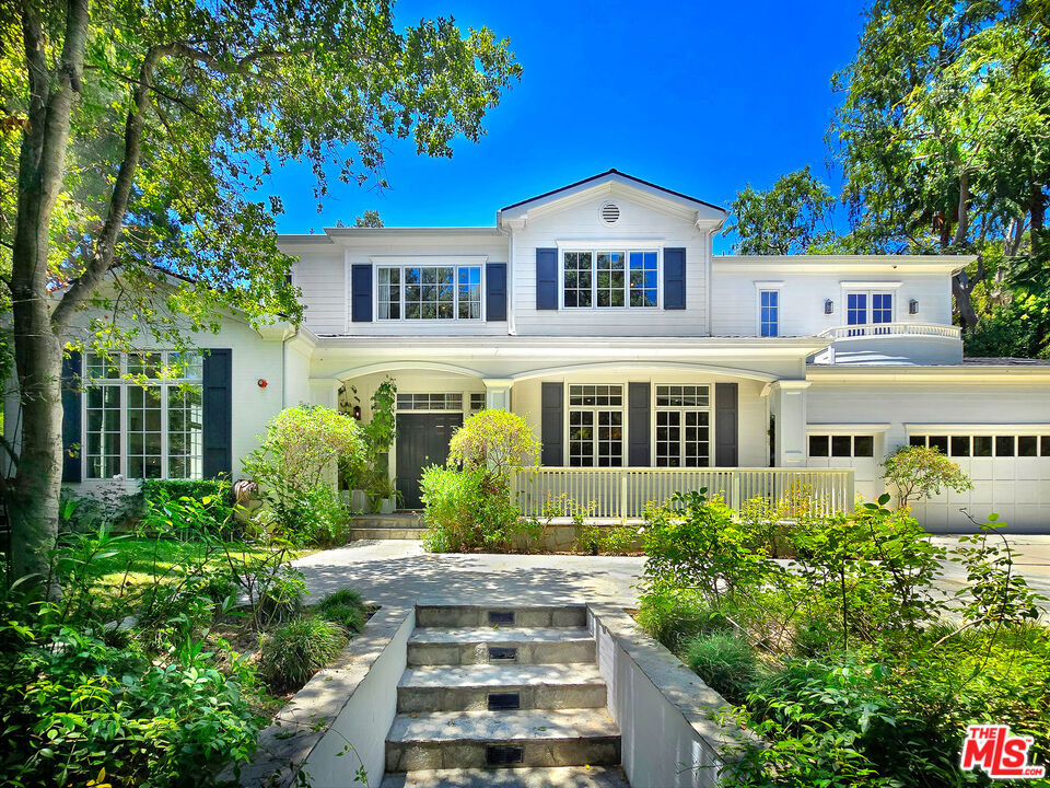Nestled on a serene knoll with sweeping canyon views, this extraordinary estate offers a rare blend of privacy, luxury, and timeless elegance. Built from the ground up in 2015, this 6-bedroom, 8-bathroom masterpiece spans over 6,400 square feet of refined living space, ensuring comfort and sophistication at every turn. Located in the highly sought-after Royal Oaks area, the home is walled and gated for ultimate privacy. The open floor plan features French doors throughout, with pocket doors in the great room, seamlessly blending indoor and outdoor living. The elegant formal living room and dining room, which includes a temperature-controlled wine room, provide a perfect setting for entertaining. The state-of-the-art chef's kitchen is a true culinary haven, featuring two center islands, luxurious Calacatta marble countertops, top-of-the-line appliances, a butler's pantry, walk-in pantry, and an adjoining breakfast area. The second level offers a home theater and a private office for work or study. The primary suite is a true retreat, complete with a spa-like bath, dual walk-in closets, and a large balcony overlooking the picturesque surroundings. Step outside to a resort-style backyard, complete with a sparkling pool and spa, a cozy sitting area with a firepit, a covered loggia, BBQ pavilion, and two grassy areas ideal for relaxation or play. This exceptional estate offers the perfect combination of luxury, comfort, and privacy in one of the most desirable neighborhoods.