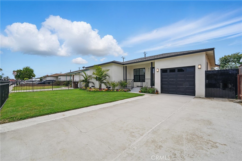 *** BEAUTIFULLY REMODELED *** This THREE bedroom, TWO bath home is READY for a NEW family to make endless memories and host gatherings. This gem has been given the touch it deserves. From the moment you drive up, you'll appreciate a beautiful curb appeal with various of color plants and palm trees. A beautiful modern wooden door that leads to a large open living room that flows openly to a dining area and family room with a perfectly centered fireplace. A gorgeous kitchen with a perfectly placed quartz counter tops and white cabinets and a black slash that compliments the kitchen. New laminate wood flooring throughout the entire home. Spacious bedrooms and remodeled bathrooms with new fixtures. A sliding door that leads to a covered side patio that is perfect to enjoy breakfast, coffee or just relax. A spacious backyard where you can entertain family and friends. This home has it all for a new family to create memories. Come by and take a tour... =) (Property has been virtually staged to demonstrate how property may look if furnished)