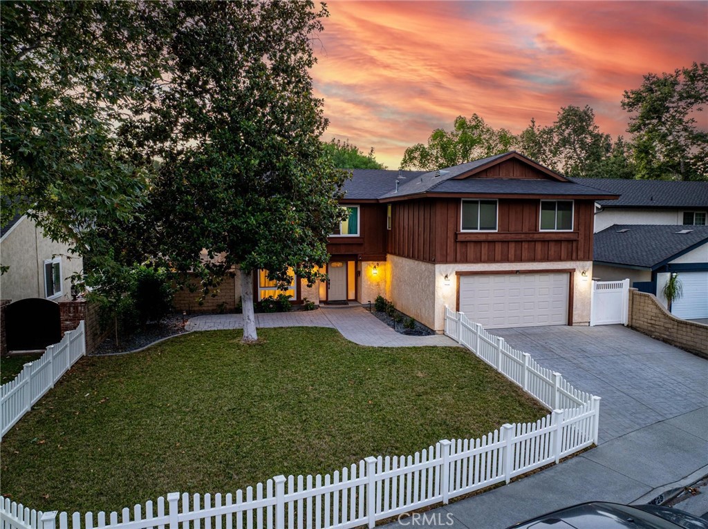 The very best of Valencia is here at the end of the cul-de-sac in this remodeled 5 bedroom. Many improvements both structural (roof, re-pipe, windows) & aesthetics (laminate floors & fresh paint). The yard has been redone front to back and behind the white picket fence you will enjoy a stamped patio & driveway, a big front grassy area plus a big patio cover in the low maintenance back yard. 5 bedrooms plus retreat, all upstairs. Even the garage has been nicely updated with epoxy floors, awesome lighting, a 220 volt sub panel & fully insulated. A really exceptional update! No HOA or Mello Roos taxes but still have access to Valencia Glen Park, paseos & public pool. Great location!
