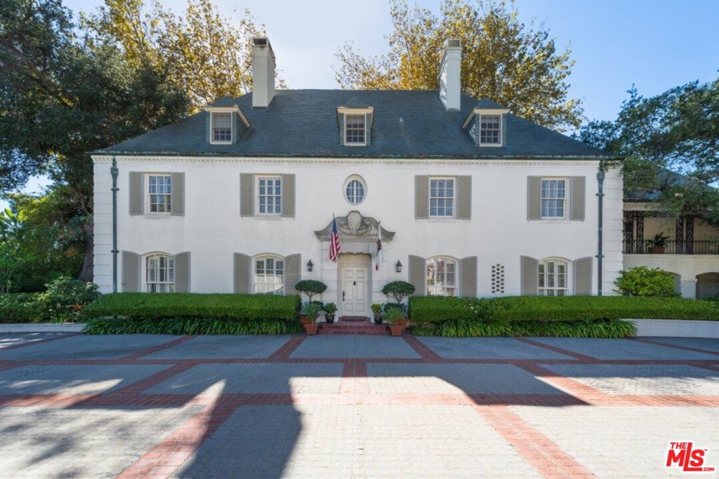 Situated in the prestigious East Gate in prime Lower Bel Air, this beautiful 8 bdrm, 10 bthrm gated French Normandy estate sits on private grounds w mature trees & rolling lawns. This iconic Bel Air estate is perfect for enjoying the California lifestyle. Almost all of the rooms are filled w natural light & capture views of the gorgeous manicured landscaping. While designed on a grand scale, the formal rooms, nonetheless, remain intimate & appealing. Crown moldings, hardwood floors & paneling throughout the estate. Main level features: wood paneled library/study, grand formal living rm & dining rm, butler's pantry, kitchen, & breakfast area. Lower level features: guest suite, den & gym. Upstairs features: master w dual baths & his/hers walk-in dressing rooms. 4th floor bonus area, may be used as children's wing, guest suite or media/screening room. Outdoor area boasts pool w GH & separate staff quarters. Set back from street, ample parking w 3-car garage & 2 spacious motor courts.