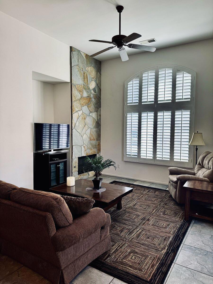 **WATERCOLORS is a 55+, income qualified community. La Quinta Housing Authority holds a ($103,000) silent 2nd that will stay with the property until 2052. TOTAL PURCHASE PRICE, including silent 2nd is: $425,000 - ($322,000 + $103,000). Buyer must meet the income limits based on household size: 1 person 62,651 to 87,300; 2 people 71,601 to 99,750; 3 people 80,551 to 112,250; 4 people 89,501 to 1224,700. MUST be PRIMARY residence; NO rentals, NO All Cash purchase, NO investment buyers. This spacious 3 BR, 1.75 BA home has Numerous upgrades including: stunning ''Flagstone'' accented fireplace; Custom tile flooring throughout the home except for bedrooms; Shutters on living room and primary bedroom windows plus slider to patio; blinds on other windows; Ceiling Fans in living room and all the bedrooms. Bedrooms have carpet. High ceilings enhance the feeling of spaciousness. Primary bedroom has large walk-in closet. Primary bath has double sink vanity and a walk-in shower w/bench. Guest/hall bath has shower over tub. Numerous storage cabinets in hall. Oversize double garage, with NEW opener, has direct access to home. LOW HOA DUES INCLUDE Community Cable + Internet; inviting community Pool/Spa + Meeting Room. INCLUDED IN SALE - **Whirlpool, side-by-side, Refrigerator w/ice & water dispenser + Frigidaire Stacked Washer/Dryer + Glass-top table & 4 chairs in garage. Home is offered UNFURNISHED.