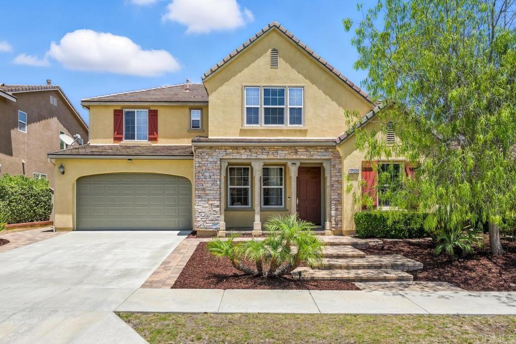 This spacious and thoughtfully designed 5-bedroom, 4-bathroom home in 4S Ranch blends comfort, flexibility, and functionality. Ideal for multigenerational living or guests, it features two bedrooms and two full bathrooms on the main level, including a private en-suite. A formal living room welcomes you in, while the rear of the home opens to a light-filled kitchen, dining area, and family room with a cozy gas fireplace. The chef’s kitchen boasts a large island with bar seating, stainless steel appliances, ample cabinetry, a walk-in pantry, and generous counter space. Upstairs, a versatile loft offers space for a second living area, media room, or office. Three additional bedrooms include a spacious primary suite with a spa-like bath, soaking tub, walk-in shower, dual vanities, and a large walk-in closet. A full bathroom serves the two secondary bedrooms. The expansive backyard features a large concrete patio—perfect for entertaining, play, or adding a fire pit, dining area, or outdoor kitchen. Additional highlights include a dedicated laundry room, two-car garage, and a location within the award-winning Poway Unified School District. Enjoy the vibrant 4S Ranch lifestyle with nearby parks, scenic green spaces, and a town center filled with shopping, dining, and recreation. Five expansive parks, including a gated splash pad and sports fields, add to the community’s appeal, with easy access to the I-15 and CA-56 highways.