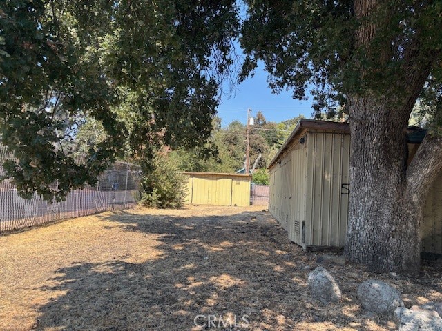 Downtown commercial lot with storage units. You must purchase duplex in front for street to street commercial zoned property.
