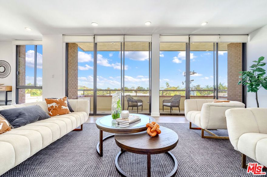 Welcome to 268 S. Lasky Drive, Unit 303  a stunningly remodeled top-floor corner residence offering penthouse-style views in the heart of Beverly Hills. Nestled on a tree-lined street near the iconic Beverly Hills Golden Triangle and located within the highly sought-after Beverly Hills School District, this rare 2-bedroom, 3-bath condominium boasts over 2,100 square feet of refined living. The airy, bright living area is illuminated by floor-to-ceiling sliding glass doors and features a stylish fireplace, a formal dining space, and a chic entertainment zone complete with a wine fridge  perfect for both intimate evenings and larger gatherings. The gourmet kitchen has been thoughtfully remodeled with custom cabinetry, a Sub-Zero refrigerator, Wolf range, extensive quartz countertops, and a generous eat-in island  ideal for culinary creativity and casual dining.The expansive primary suite offers tranquil tree-top views, a large walk-in closet, and a spa-quality ensuite bathroom featuring double sinks, abundant counter space, a separate designer soaking tub, stand-alone shower, and a private water closet for added comfort. The second bedroom is a private suite of its own, featuring a full ensuite bathroom and a spacious closet  ideal for guests or family members seeking privacy and convenience. A stylish powder room is located just off the main living area, and an in-unit laundry room adds ease to your everyday routine.  Additional features include extra storage, generous closets throughout, two side-by-side parking spaces, and plentiful guest parking. This exceptional corner unit is located in a secure, well-maintained, and recently upgraded building that offers 24/7 controlled access, an advanced security system, and professional lobby staff on-site during weekday business hours. Live moments from world-renowned shopping on Rodeo Drive, fine dining, high-end entertainment, Century City Mall, Rancho Park Golf Course, and The Los Angeles Country Club. This penthouse-level move-in-ready gem feels every bit like a private home, while providing all the ease and security of luxury condominium living.