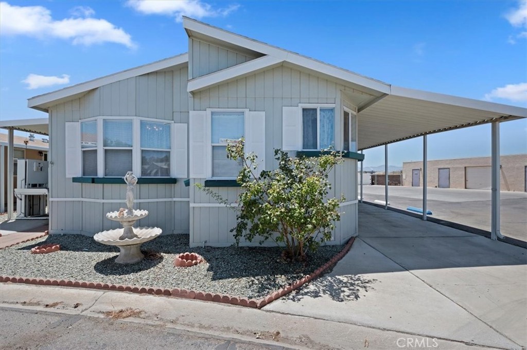 Beautiful, spacious, manufactured home in a 55+ gated community with accessibility features inside and out! It is the largest home on the market with lots of extra amenities! Large rooms throughout, walls made of drywall, ceiling fans, light fixtures, lots of cabinets and storage inside, separate tub and shower in Primary Bedroom, laundry room, huge kitchen with pantry and desk areas included, wheelchair lift access to the large porch area, pet access door, storage shed, extra parking, and so much more. Some of the Park's amenities: Clubhouse, swimming pool, spa, sauna, recreational facilities with planned social events/activities, tennis court, golf course, fitness center, billiard room, BBQ area, and nice views of the surrounding mountain ranges. It's also close to shopping, dining, and commuter friendly. Please see the updated photos and price!