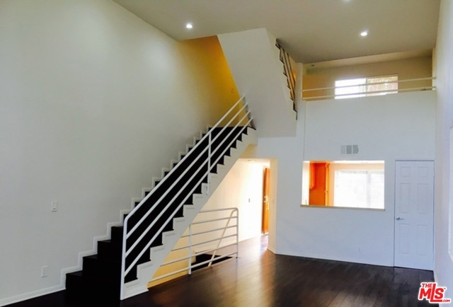 HUGE tri-level townhouse w/ 2 BR (both w/ 2 ensuite bathroom). 3rd BR is an upstairs loft-style w/ full bathroom. Townhouse has a big kitchen that passes through to the dining area and a very spacious living room with working fireplace. A large private balcony entertains very comfortably. Perfect floor plan for roommates as each floor can be private with it's own entrance, bathroom and outdoor space. A balcony on every floor overlooking Los Feliz and beyond + a private rooftop sun deck. Laundry in unit! Large Private garage. Guest parking. Walking distance to Hyperion cafe scene, restaurants and retail.