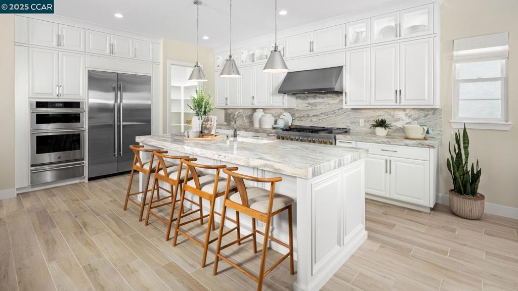 Welcome to Regency at Tracy Lakes, with luxury living at this active adult 55+ gated community. With three picturesque lakes, this community offers a fishing dock, 1-acre garden and dog park. With a wealth of amenities, including a clubhouse, indoor and outdoor pools, cabanas, a yoga studio, fitness center, bocce ball, and pickleball courts, every day here is an opportunity for relaxation and recreation. Onsite lifestyle director ensures there’s always something to look forward to; from fitness classes to comedy shows and wine nights. This stunning home with a desirable lakefront location boasts an expansive great room with a cozy fireplace and a casual dining area, leads to luxurious outdoor living space with pristine views of the lake. The kitchen is expertly designed, complete with upgraded JennAir stainless steel appliances, 48" gas range, a large center island with breakfast bar. Primary bedroom suite is defined by an expansive walk-in closet and a spa-like primary bath. Create your ideal living space with a generous flex room. Thoughtfully designed interior finishes include elegant craftsmanship with 10-foot ceilings, 8-foot doors, 5 1/4" baseboards, pre-wired home theater surround sound at great room. Convenient powder room and laundry. (photos not of actual home)