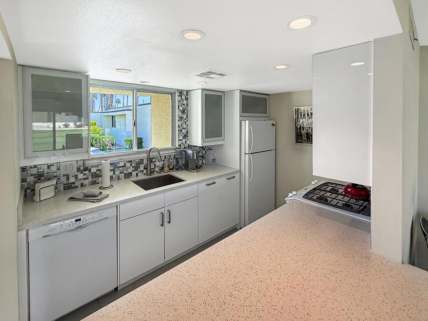 Step inside Coco Cabana Unit 16, a beautifully renovated condo that seamlessly combines iconic Palm Springs design with everyday comfort. Featuring two spacious bedrooms, a bright open-concept living area, and floor-to-ceiling glass walls showcasing panoramic mountain views, this home embodies the spirit of desert living.The interiors boast sleek quartz countertops, custom cabinetry, and porcelain tile floors throughout, creating a clean, modern look that is both timeless and easy to maintain. Every space has been thoughtfully updated, from the kitchen to the bathrooms, offering a move-in ready experience for full-time residents or investors looking for rental income potential.Located in the highly desirable Coco Cabana community, known for its classic mid-century architecture and proximity to South Palm Springs attractions, this property combines style, comfort, and value in one attractive package.Whether you're seeking a personal retreat or a proven income-generating property, Unit 16 is ready to impress with its design appeal, prime location, and competitive pricing in today's market. Fully furnished.