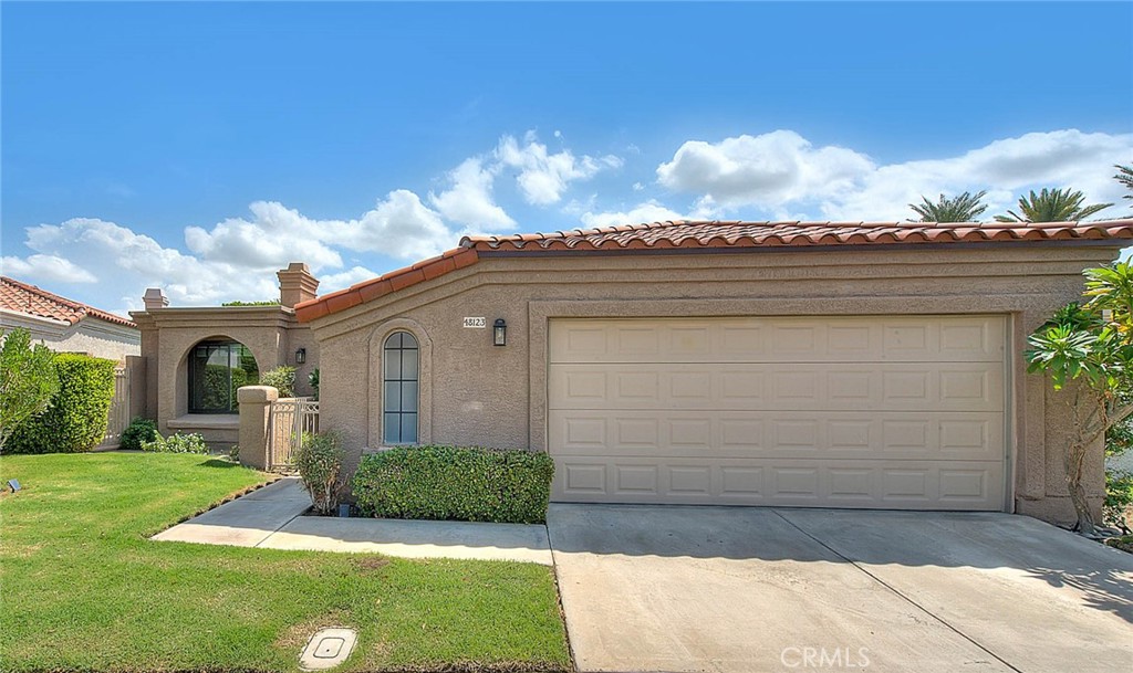 Discover your dream home in the prestigious guard-gated community of Laguna De La Paz. This stunning 3-bedroom, 3-bath residence offers over 1,900 sq ft. of living space complemented by a spacious lot and sparkling private pool-perfect for relaxing or entertaining in true desert style! Step through a private covered courtyard into a living room flooded with natural light, featuring one of two cozy fireplaces. The remodeled kitchen, complete with custom pull-out drawers and modern finishes, flows effortlessly into the dining area which offers wraparound views of the pool and backyard.
The home features two master suites, each with spa-like bathrooms and ample closet space. The third bedroom, also with its own full bath, is large and inviting, offering a private and luxurious space. Recent upgrades include Swiss Tech garage flooring with a Tesla charger, a mini-split AC in the two-car garage, a new Lennox multi-speed AC with iComfort smart control, new Pentair pool equipment with app-based control, brand-new windows, and a newer tankless water heater. Laguna De La Paz provides resort-style amenities with a 5-acre lake, 15 pools and spas, tennis and pickleball courts, fitness center, and beautiful mountain views. Whether you’re seeking a full-time residence or a desert escape, this home’s modern features and resort-style amenities make everyday living feel like a vacation!