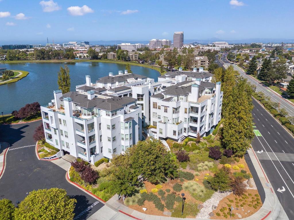 Welcome to Promontory Point, Foster City's premier luxury condominium community. Ideally located off East Hillsdale Blvd, the complex offers access to Hillsdale and Bridgepointe Shopping Centers, parks, trails, and quick connections to Highways 92 & 101. The neighborhood is also served by top-rated schools. This private, secure main-floor residence is updated and well maintained. Enter through a dramatic foyer and enjoy designer touches throughout. The open floor plan flows from the formal dining area to a spacious living room with gas fireplace and sliding doors to the balcony. Wainscoting and recessed lighting add timeless character. The chef's kitchen features granite countertops, a center island with prep sink, ample cabinetry, and stainless steel appliances. Open to a breakfast nook and large family room, the layout is ideal for everyday comfort & entertaining. The primary suite offers balcony access, a spa-like bath with dual vanities, soaking tub, walk-in shower, and walk-in closet. Two additional bedrooms share a Jack-&-Jill bath. Other features include a powder room, laundry with sink, and two parking spaces with extra storage. Community amenities include a gym, pool, spa, and clubhouse. 740 Promontory Point Ln, # 3109, offers a rare blend of space, style, and location.