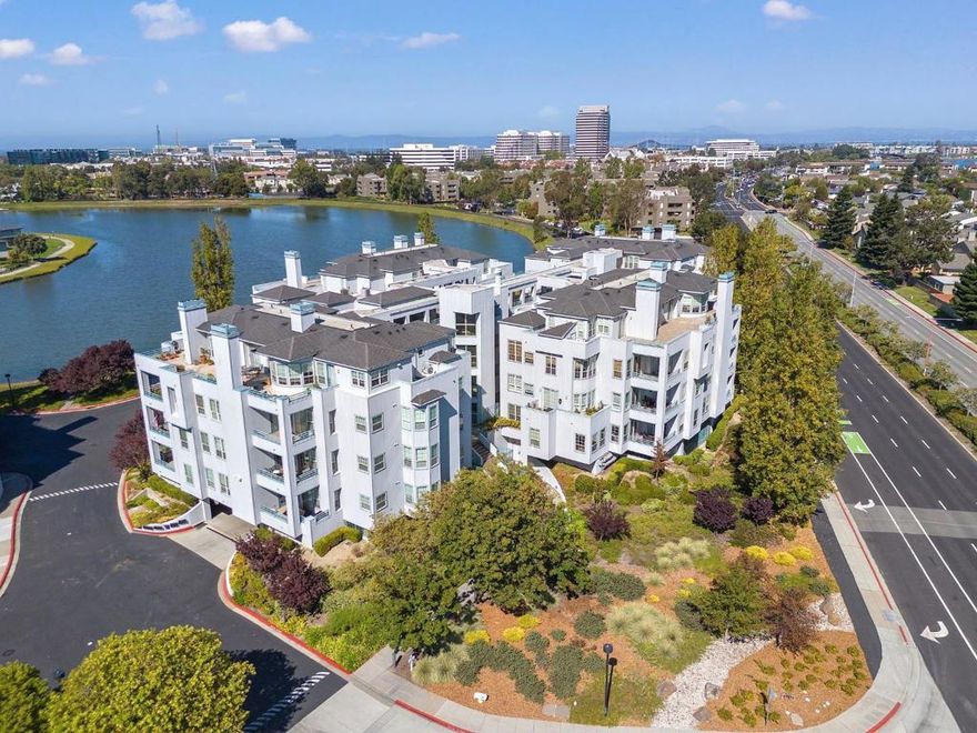 Welcome to Promontory Point, Foster City's premier luxury condominium community. Ideally located off East Hillsdale Blvd, the complex offers access to Hillsdale and Bridgepointe Shopping Centers, parks, trails, and quick connections to Highways 92 & 101. The neighborhood is also served by top-rated schools. This private, secure main-floor residence is updated and well maintained. Enter through a dramatic foyer and enjoy designer touches throughout. The open floor plan flows from the formal dining area to a spacious living room with gas fireplace and sliding doors to the balcony. Wainscoting and recessed lighting add timeless character. The chef's kitchen features granite countertops, a center island with prep sink, ample cabinetry, and stainless steel appliances. Open to a breakfast nook and large family room, the layout is ideal for everyday comfort & entertaining. The primary suite offers balcony access, a spa-like bath with dual vanities, soaking tub, walk-in shower, and walk-in closet. Two additional bedrooms share a Jack-&-Jill bath. Other features include a powder room, laundry with sink, and two parking spaces with extra storage. Community amenities include a gym, pool, spa, and clubhouse. 740 Promontory Point Ln, # 3109, offers a rare blend of space, style, and location.