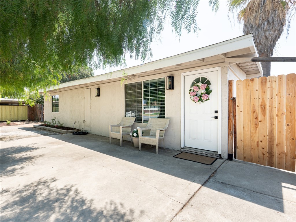 PAID OFF SOLAR |LOW TAXES | NO HOA | LARGE LOT WITH TONS OF PARKING | Welcome home! This charming 3 bedroom home is situated on a large lot with tons of driveway space and a large backyard with tons of potential. The home is located within walking distance of all the grocery stores, shopping, and dining you'll need! As you work your way into the home you'll be greeted with an updated kitchen and oversized island perfect for entertaining. The living space offers plenty of natural lighting and access to the big backyard. You'll find upgraded laminate flooring all throughout the home and a built in cozy fireplace in the living room. Down the hall you will find the spacious bathroom with double sinks, and upgraded vanity, and a shower/tub combo. The Primary bedroom is connected to the bathroom for convenience. The other 2 secondary bedrooms also have upgraded flooring throughout. This home has a large lot perfect for parking RVs, boats and more vehicles.