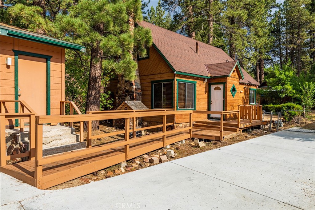 Nestled in the heart of Big Bear Lake’s sought-after Boulder Bay neighborhood, this charming and well-maintained vintage cabin offers timeless character and unbeatable location just a short walk from the lake, Boulder Bay Park, and Pleasure Point Marina. Featuring 3 bedrooms, 2 bathrooms, and 1,406 sq ft of living space, the home showcases classic mountain appeal with original wood finishes, knotty pine ceilings, hardwood floors, and a native-stone fireplace. Though dated, it has been lovingly cared for and is in excellent condition, offering a spacious eat-in kitchen, wrap-around deck, large mudroom/laundry area, and a detached two-car garage. With R-3 zoning, there's potential to add a second unit for extended living or income-producing use. Enjoy close proximity to lake activities, hiking trails like Castle Rock, the scenic Alpine Pedal Path, and Big Bear Village’s shops, restaurants, and year-round entertainment. Whether you're looking for a cozy full-time residence, vacation getaway, or investment opportunity, this home combines classic charm, solid bones, and an unbeatable location.